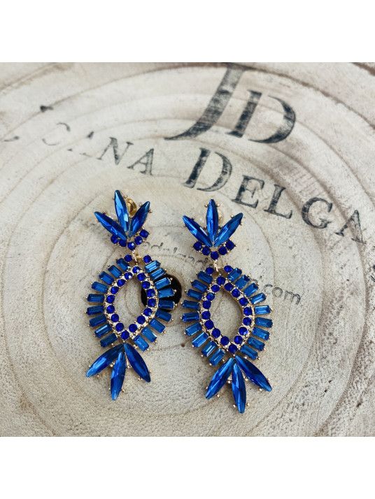 Pendiente de fiesta dorado con piedras de color.