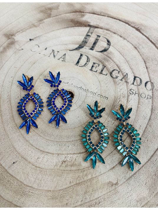 Pendiente de fiesta dorado con piedras de color.
