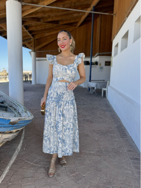 Conjunto de dos piezas compuesto por top y falda  de vuelo.