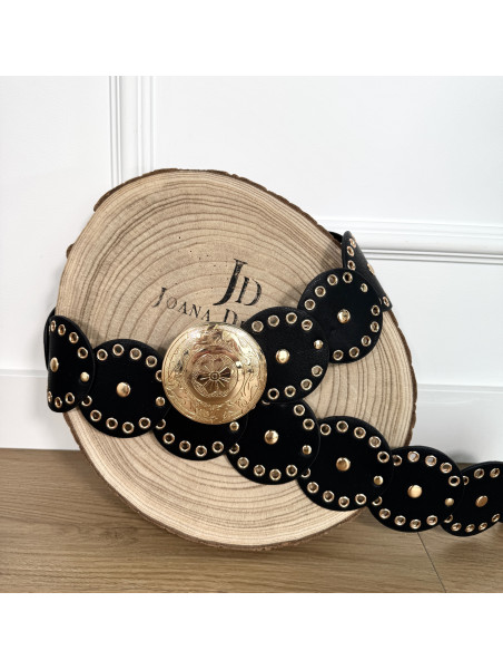 Cinturón de polipiel color negro formado por círculos.