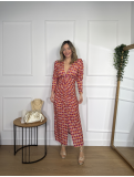 Vestido midi estampado en tonos fucsia, naranja y beige.