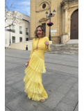 Vestido largo con flecos en color amarillo.